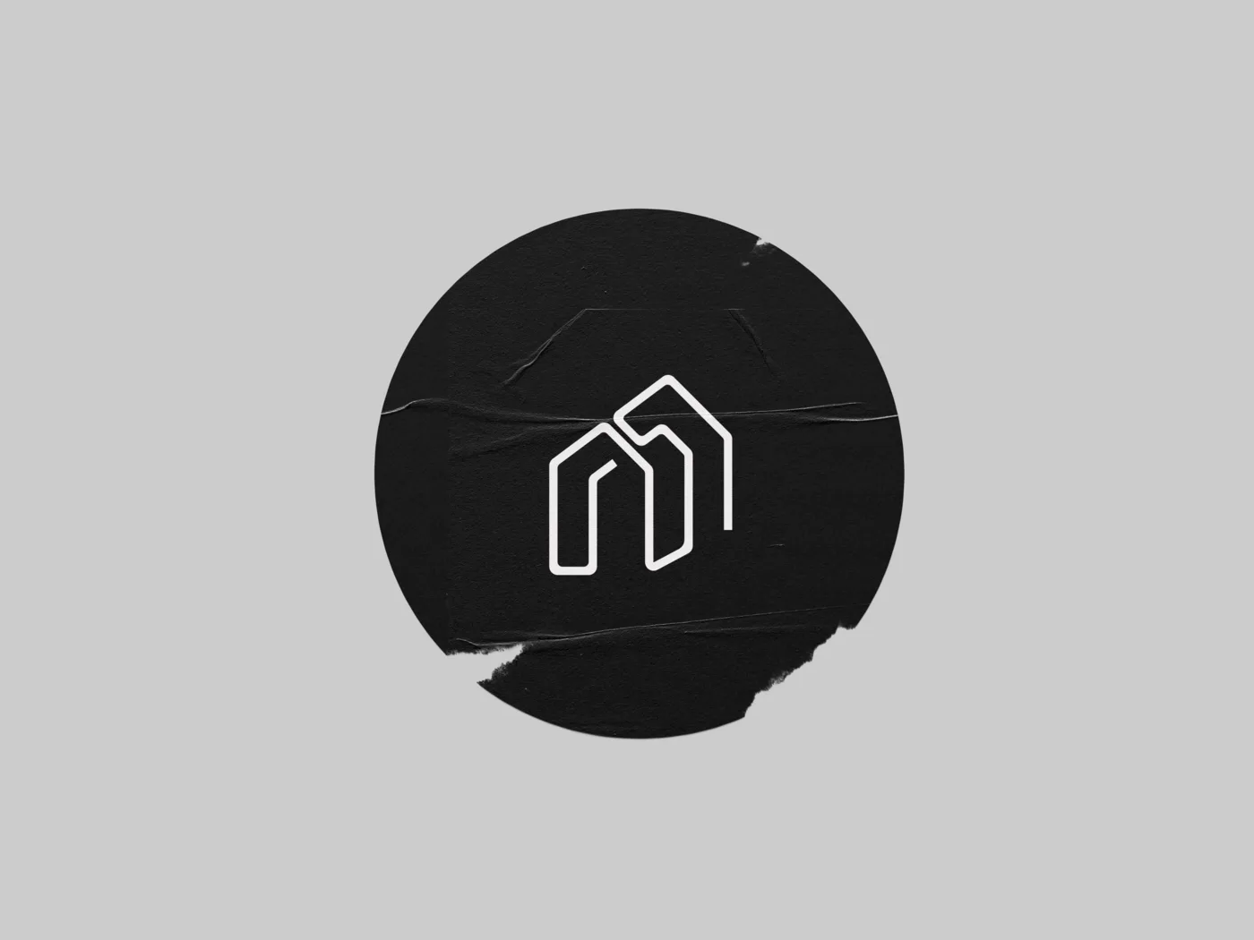 Circle sticker — monogram lockup
